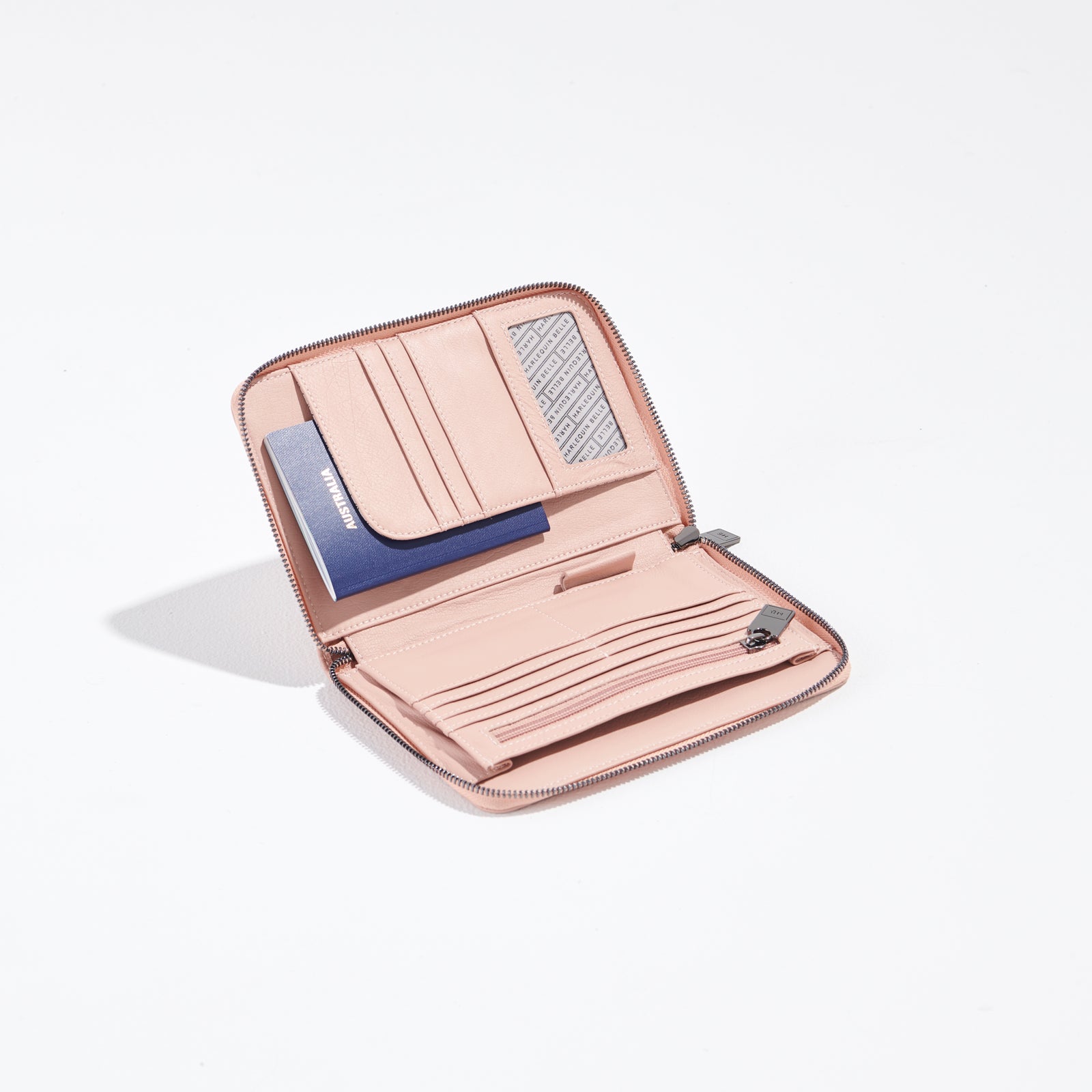 blush pink travel wallet open with passport